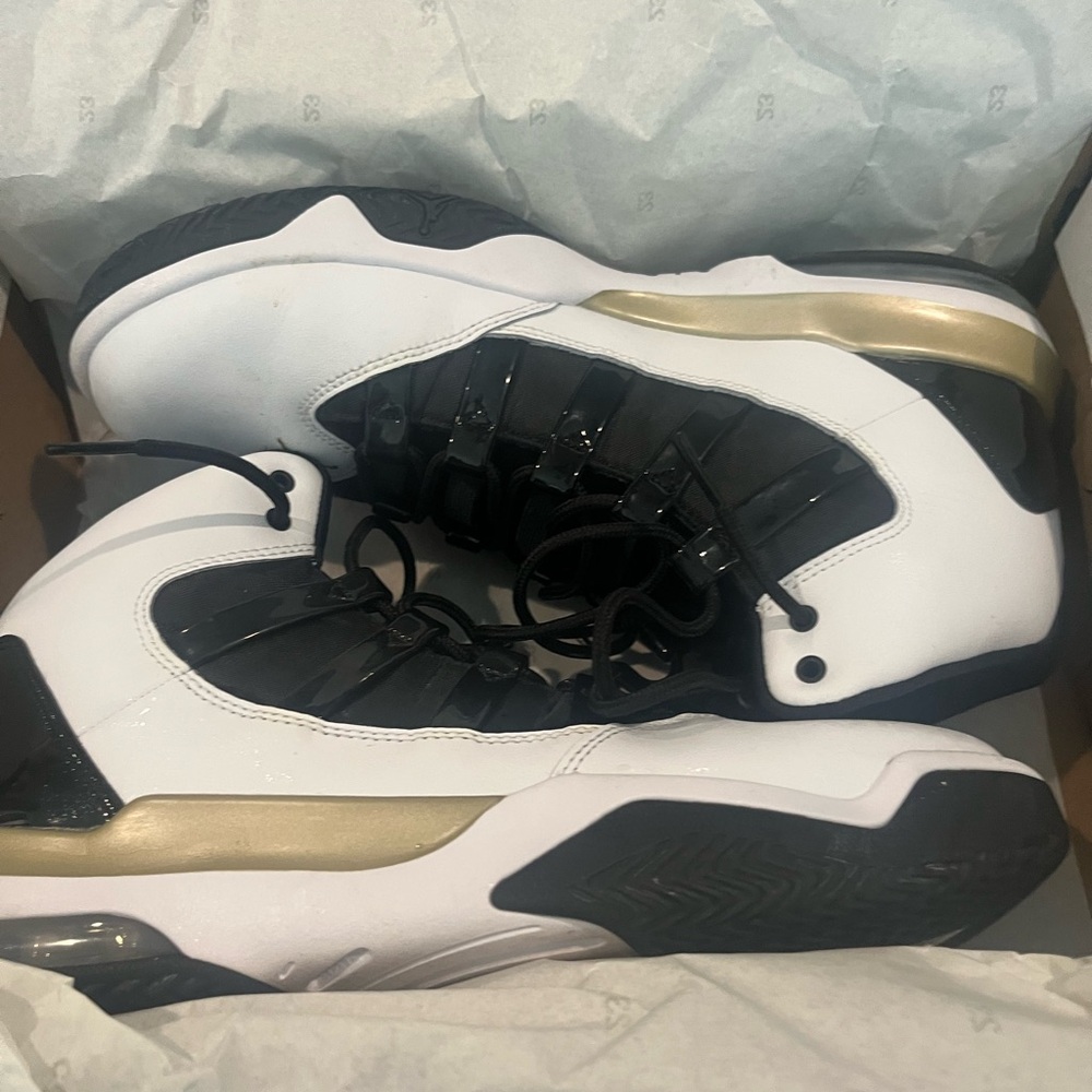 White and Black High-Top Jordan with Gold Accents